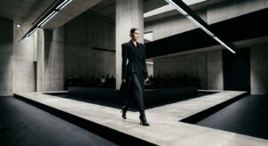 A sophisticated, high-fashion editorial shot featuring a minimalist luxury boutique runway with shar